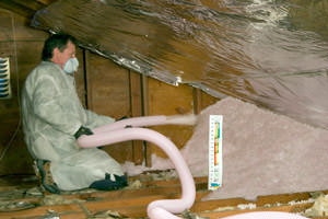 Fiberglass Insulation being used to add energy efficiency to an attic in Hyde Park